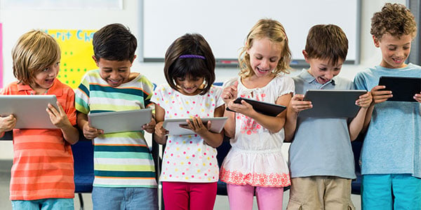 Children using iPads at school.